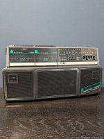 Front view of Magnavox D-8300 showing dual cassette doors, speakers, control panel