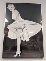Full view of framed Marilyn Monroe black & white photo in silver metal frame
