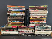 Full lot, three vertical stacks and two horizontal rows showing majority of titles including Planet Earth II centre