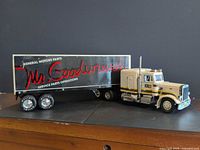 Side profile of Peterbilt tractor and Mr. Goodwrench trailer showcasing graphics and condition