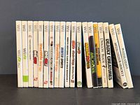 Row of 18 Wii game cases, spines visible