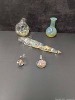 Group view of all five hand-blown glass pieces