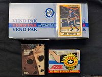 Three hockey card boxes grouped: O-Pee-Chee Vend Pak, Pro Prospects CardArt, Score Young Superstars
