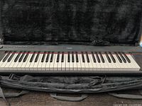 Top view of Yamaha NP-12B keyboard in soft case