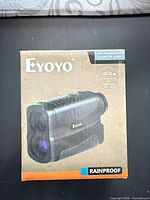 Front of Eyoyo laser rangefinder box showing brand, product type and rainproof label
