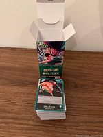Stack of Japanese One Piece TCG cards with opened box packaging visible