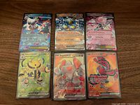 Front view of six Pokémon EX cards in sleeves