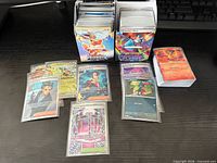 Bulk cards in two deck boxes and sleeved feature cards laid out