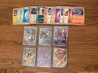 Overview of all cards: 6 full-art rares in sleeves below, bulk cards above