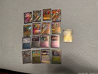 All seventeen Japanese Pokémon holographic cards laid out