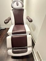 Front view of brown and white GreenLife electric massage chair