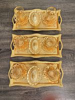 Three complete tray sets laid out