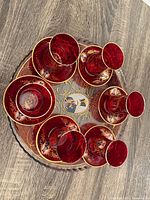 Overall view of six cups with saucers on matching tray