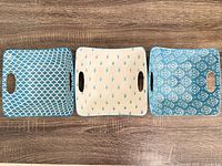 Top view of three square blue and white ceramic bowls