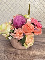 Front view of vase with mixed silk flowers