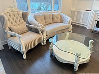 Sofa, accent chair and glass-top coffee table overview
