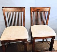 Front view of both chairs showing design and upholstery