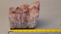 front angled view showing crystal points and ruler for scale