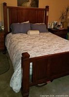 Front view of assembled bed showing headboard design and finish