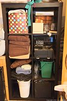 Front view of IKEA Expedit 2x4 shelf filled with assorted personal items