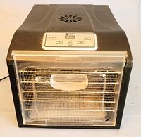 Front view of Magic Mill food dehydrator with closed transparent door