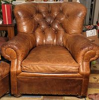Front view of leather Buster chair showing overall design and condition
