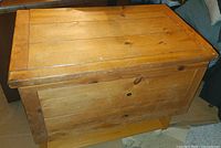 Closed pine chest front and top view