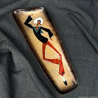 Full view of rectangular enamelled copper plaque featuring dancing sailor