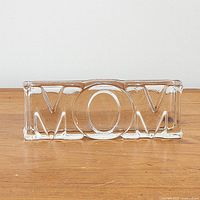 Front view of clear glass MOM paperweight