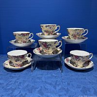 Full set of six cups stacked on six saucers