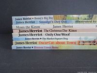 Spines showing all 8 James Herriot titles