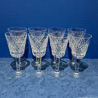 Eight Waterford Alana crystal white wine goblets standing in two rows