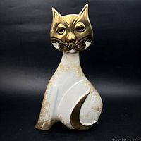 Front view of Pauline Pelletier ceramic cat sculpture showing gold head and white body