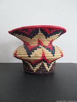 Side view of flared coil basket vase showing color pattern and shape