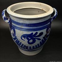 Full view of crock showing cobalt blue decoration and handles