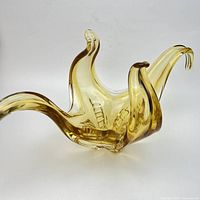 oblique view showing three curved arms and colour