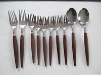 Full 10-piece flatware set laid out showing all utensil types