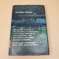Front view of hardcover book with dust jacket titled "vacation houses"