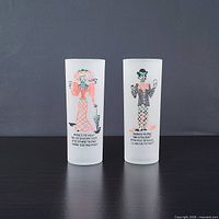 Front view of both frosted cocktail glasses showing graphics