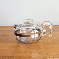 Right side view of complete Pyrex glass teapot with lid