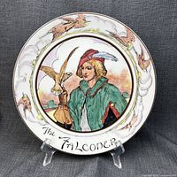 Front view of Royal Doulton The Falconer plate on stand