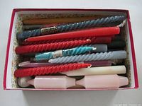 Candles in original storage box showing colours and spiral styles