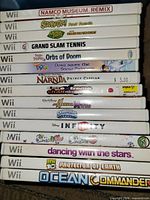 Stack of Wii game cases showing spines and titles