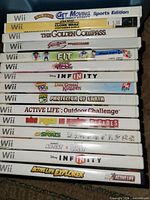 Stack of Wii game cases showing spines for title verification