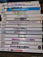 Spine view of stacked Wii game cases showing all titles