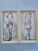 Front view of both framed Maio prints