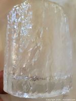 close view of one tumbler showing ice-like texture and base