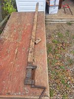 Full view of entire sash clamp laid on table