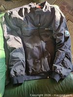 Front view of Puma BMW Motorsport jacket laid flat