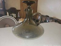 Front view of smoky glass decanter with stopper in place